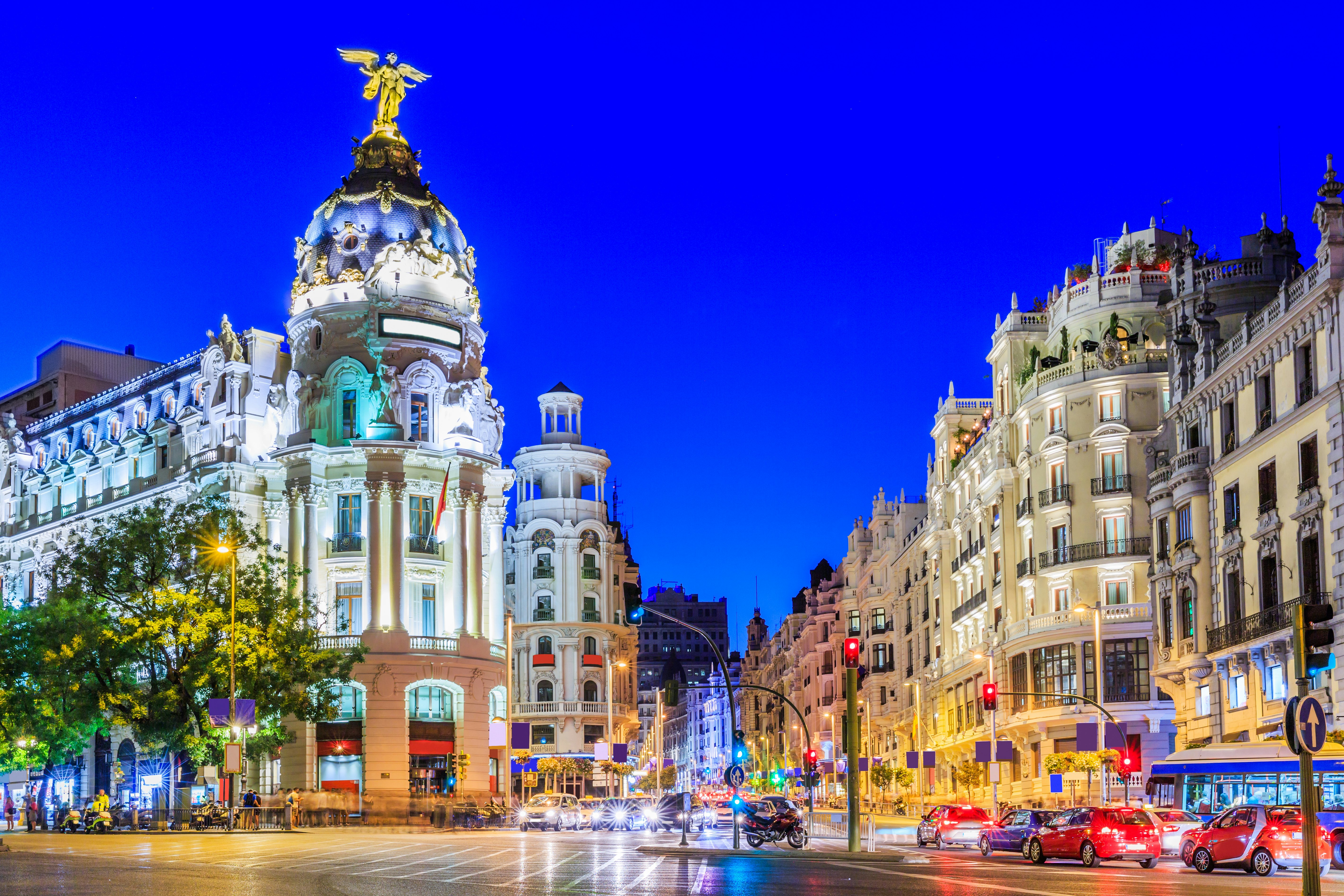Busy traffic on the streets of Madrid at dusk