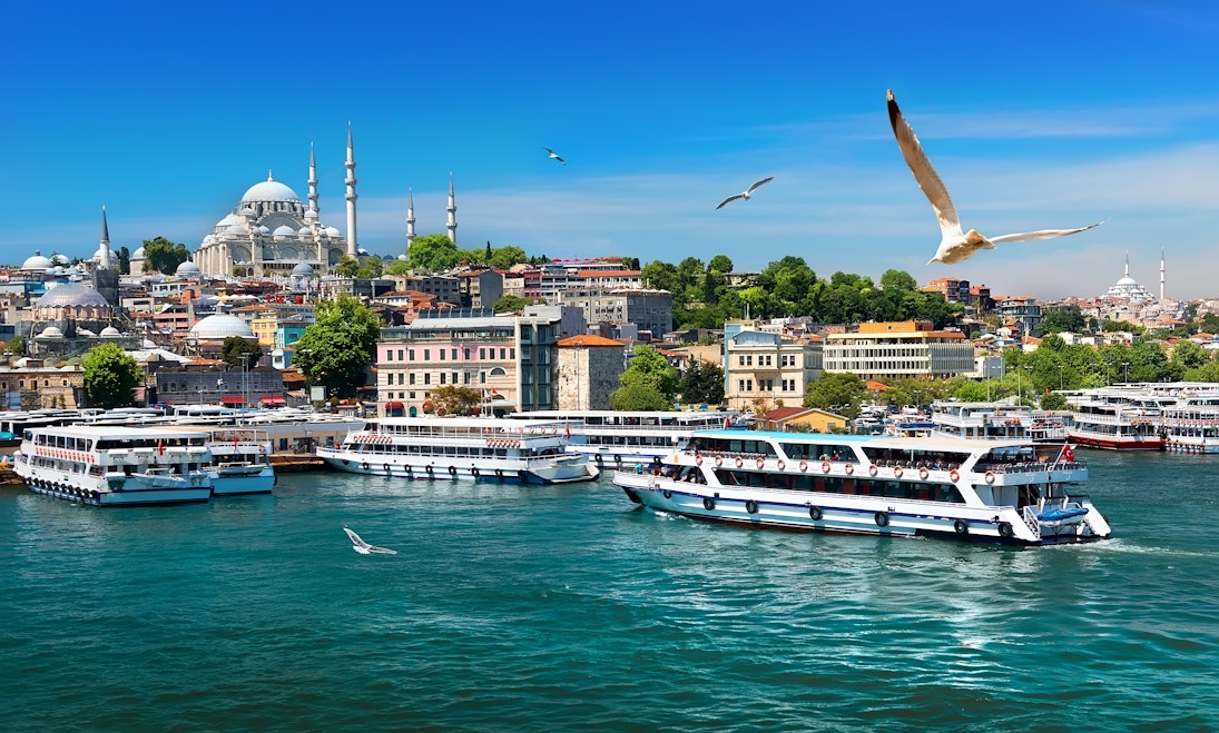 Ferries in the Golden Horn with the Suleymaniye Mosque in the background in Istanbul, Turkey.