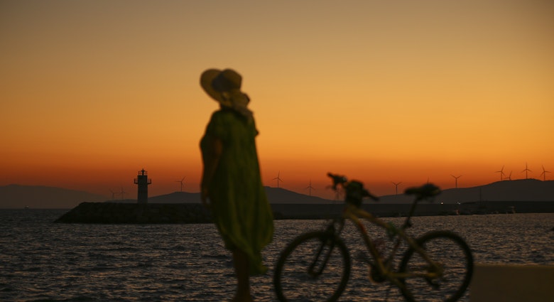 IZMIR, TURKEY - JULY 14: A woman walks near a coastline with her bicycle during sunrise in Foca district of Izmir, Turkey on July 14, 2021. (Photo by Ismail Duru/Anadolu Agency via Getty Images)
1233967343
sunrise