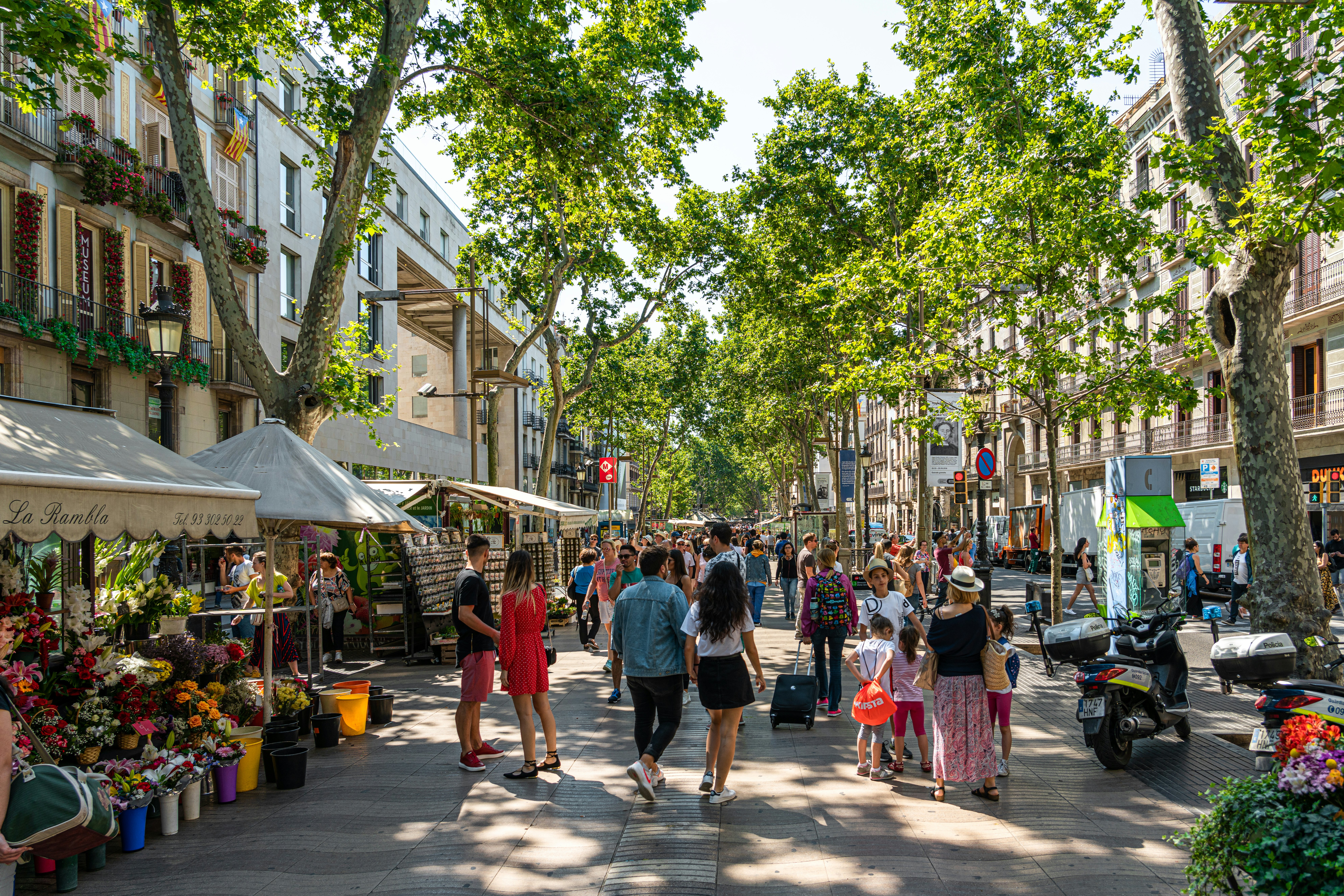 Crowd Of People And Central Downtown Barcelona City On La Rambla Street.