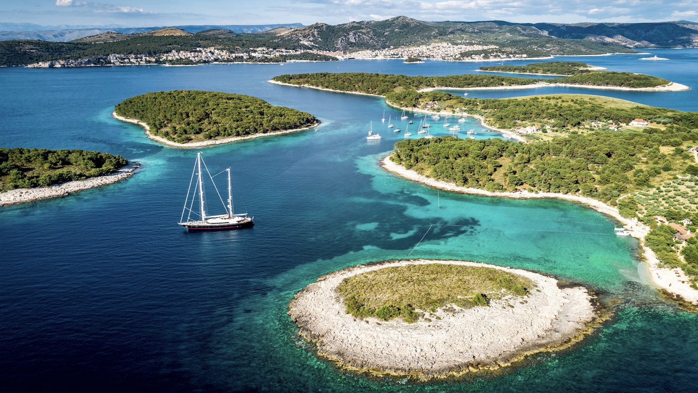 Aerial view of Paklinski Islands in Hvar, Croatia. Turquise water bays with luxury yachts and sailing boats. Toned image.
1810555702
adriatic, aerial, bay, beach, beautiful, blue, clear, coast, coastline, croatia, croatian, dalmatia, destination, drone, europe, famous, hells, holiday, hvar, island, islands, landmark, landscape, luxury, marina, marinkovac, mediterranean, nature, nautical, ocean, pakleni, paklinski, sailing, sea, seascape, ship, sky, summer, tourism, travel, vacation, vessel, view, water, yacht, yachting, aerial photography, bird perspective, hvar croatia, turquoise water, Boat, Coast, Land, Nature, Outdoors, Sea, Shoreline, Transportation, Vehicle, Water
Aerial view of Paklinski Islands in Hvar, Croatia. Turquise water bays with luxury yachts and sailing boats.