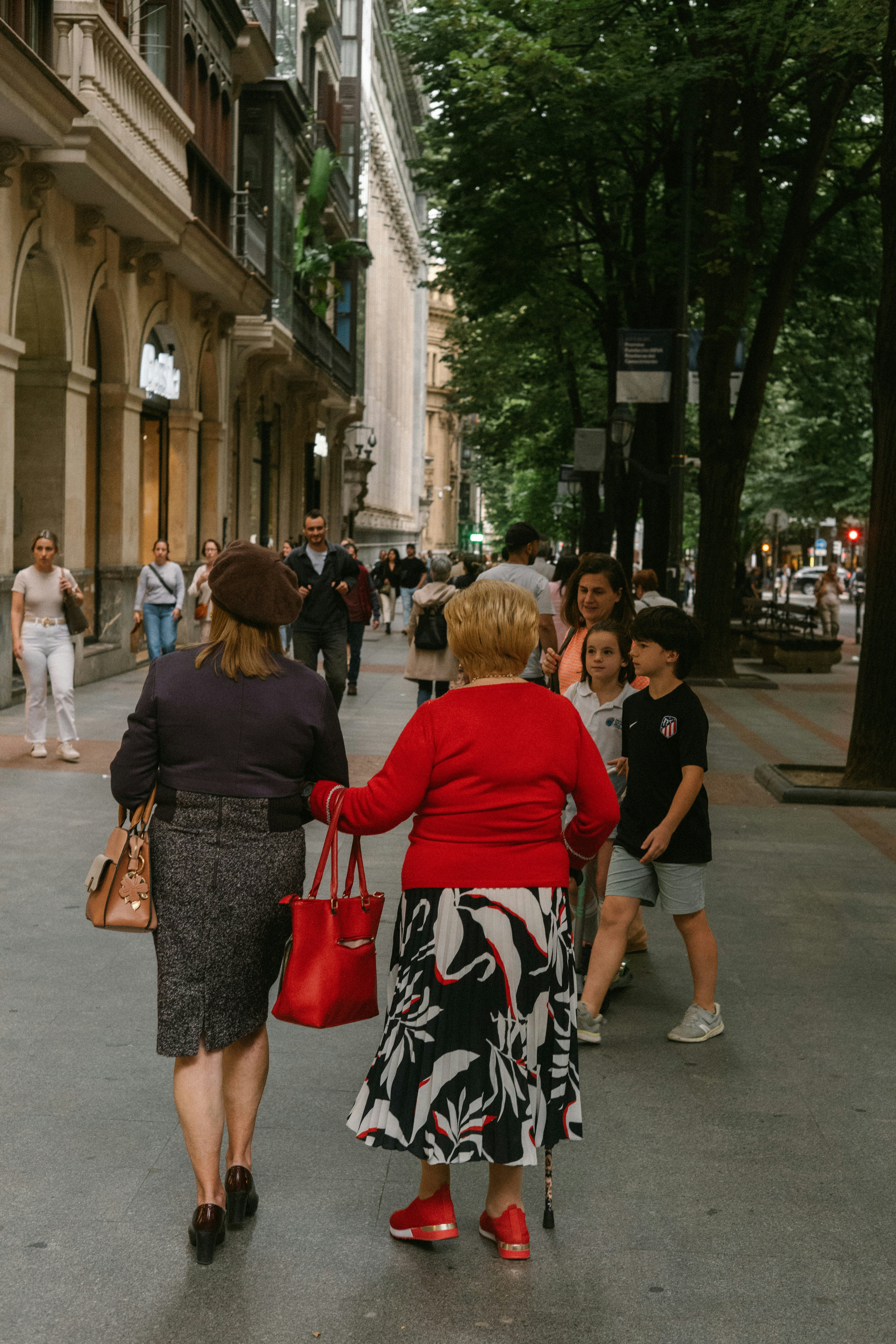 Strolling along Gran Vía de Don Diego López de Haro in Bilbao, Spain